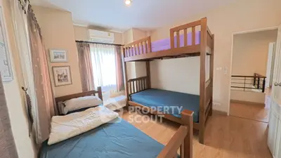 Charming bedroom with bunk beds and natural light, perfect for family living.
