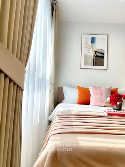 Bright and cozy bedroom with modern decor and large window