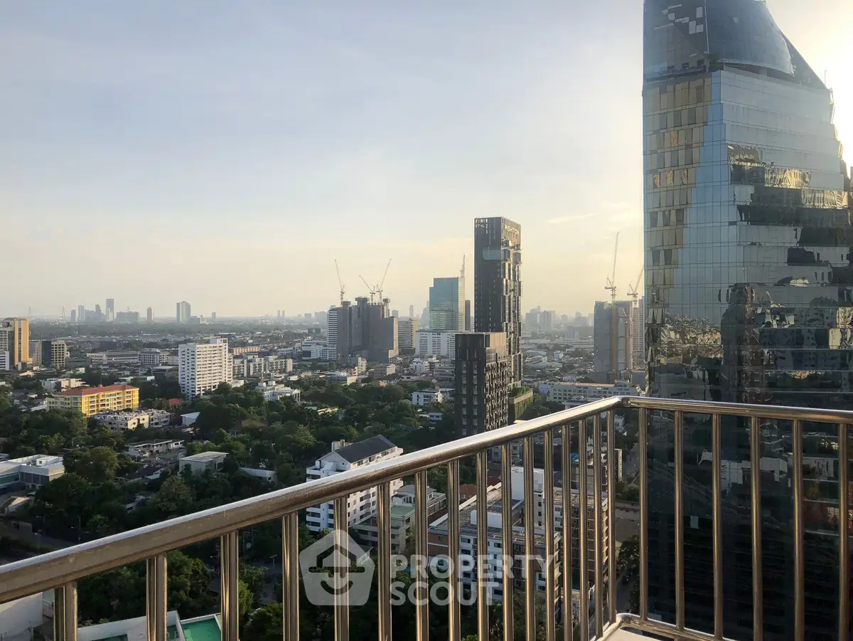 Stunning cityscape view from a high-rise balcony with modern architecture.