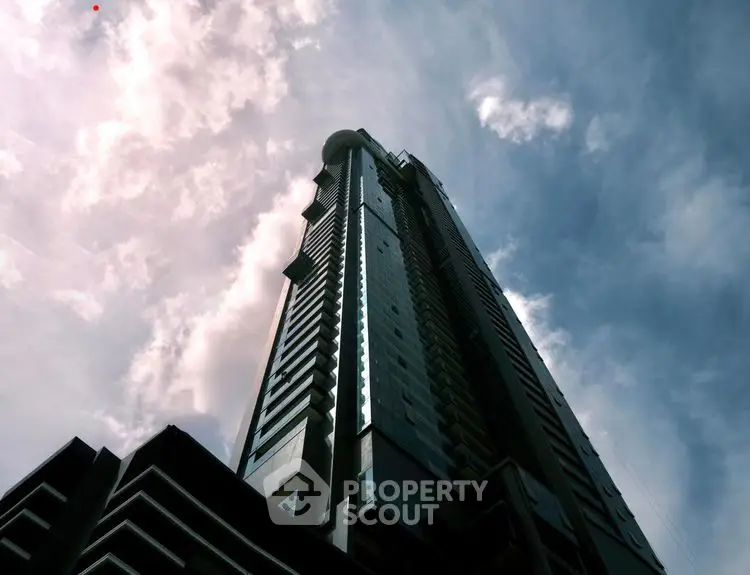 Stunning skyscraper against a vibrant sky, showcasing modern architectural design.