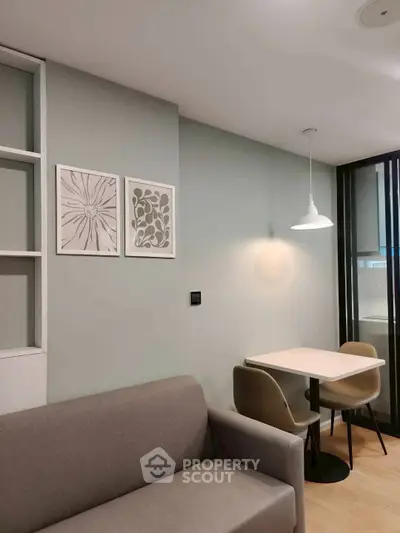 Modern living room with cozy sofa and stylish dining area