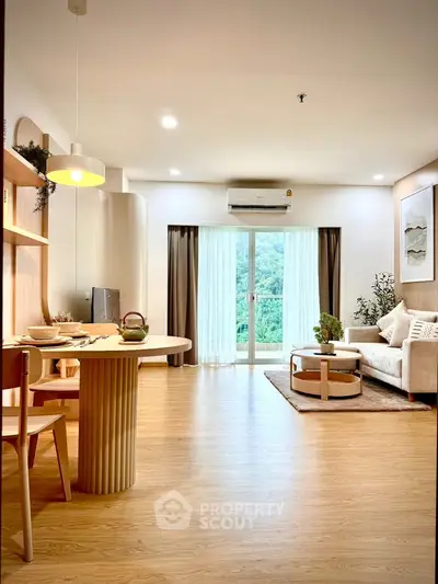 Modern living room with elegant decor and large window view