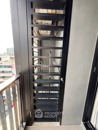 Modern balcony with sleek metal railing and city view