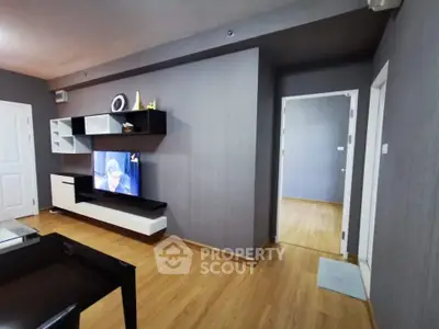 Modern living room with sleek wall-mounted TV and stylish shelving