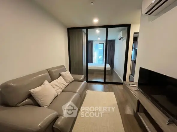 Modern living room with sleek design and cozy ambiance