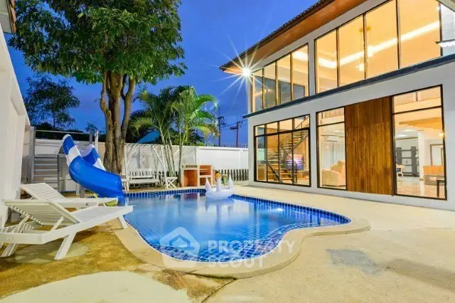 Stunning modern home with private pool and slide, perfect for family entertainment.