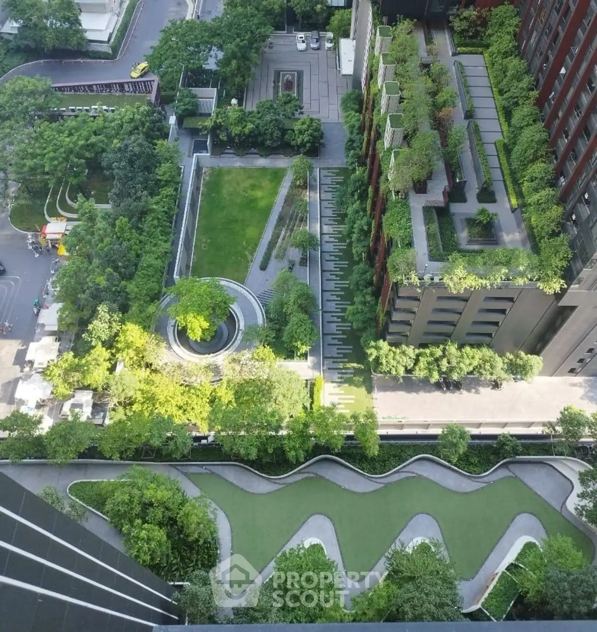 Stunning aerial view of modern urban garden with lush greenery and unique architectural design.