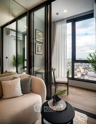 Modern living room with floor-to-ceiling windows offering stunning city views, elegant decor, and cozy seating.