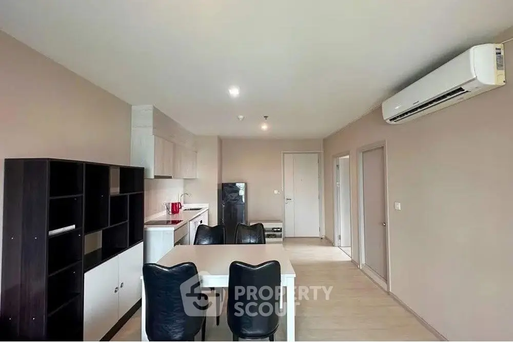 Spacious modern living room with dining area and air conditioning