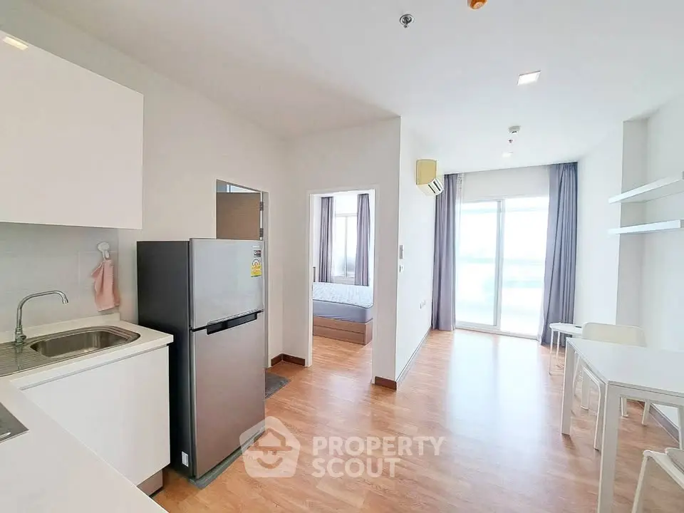Modern apartment interior with open kitchen and bright living area
