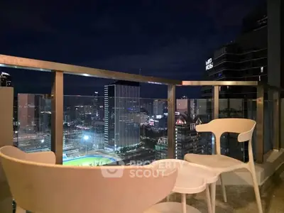 Stunning cityscape view from a modern balcony with sleek furniture, perfect for urban living.