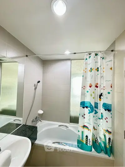 Modern bathroom with bathtub and colorful shower curtain