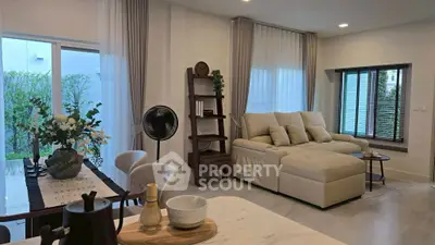 Spacious modern living room with elegant decor and ample natural light