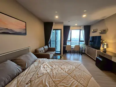 Modern studio apartment with cozy living area and scenic view