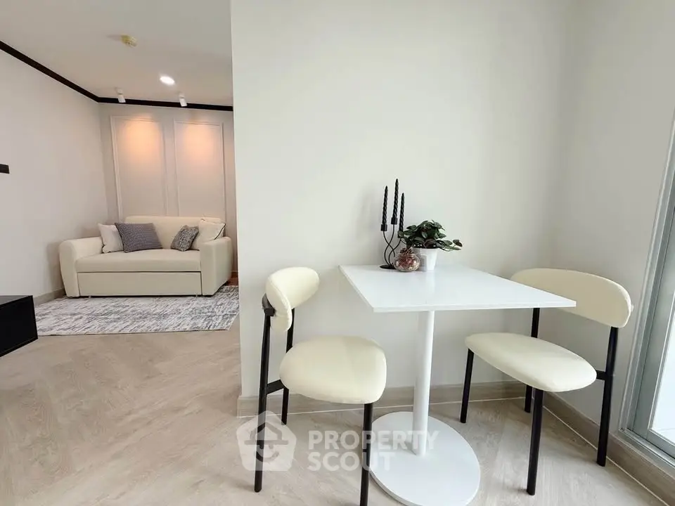 Modern living room with cozy seating and elegant dining area