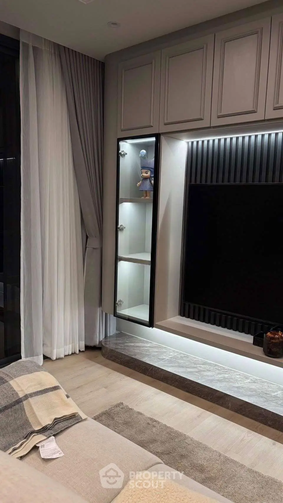 Modern living room with sleek TV unit and elegant decor