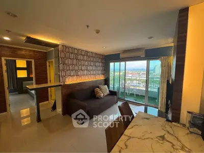 Modern living room with city view, featuring stylish decor and spacious layout.