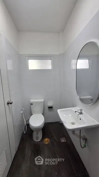 Modern minimalist bathroom with sleek fixtures and natural light