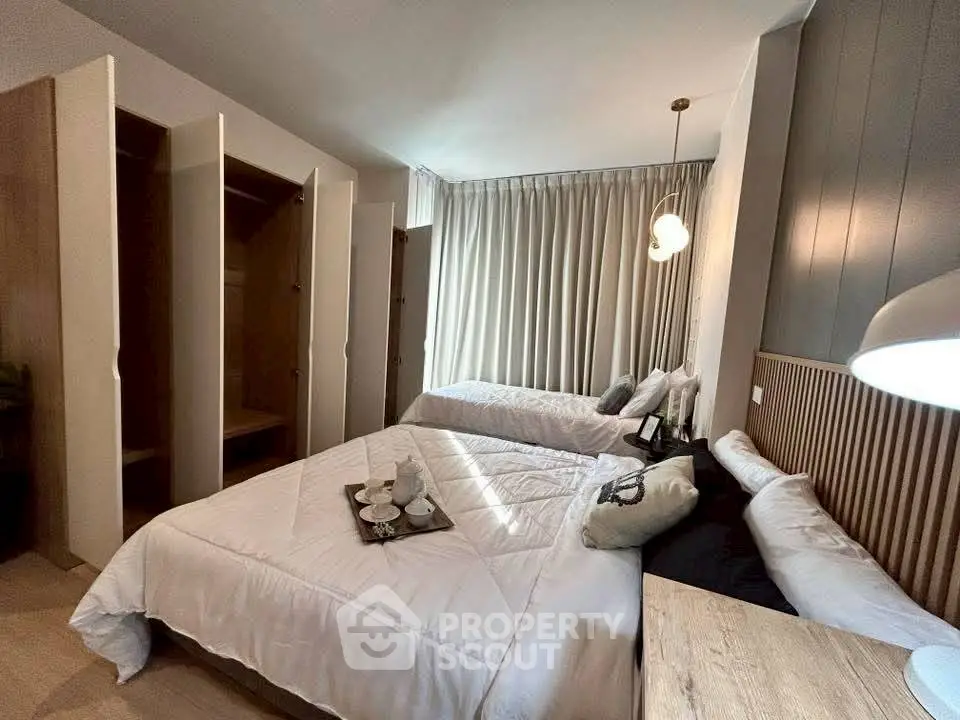 Spacious bedroom with elegant decor and ample closet space, perfect for modern living.