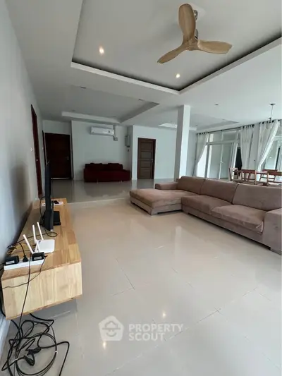 Spacious modern living room with sleek furniture and open layout