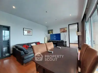 Spacious living room with modern furniture and large windows offering natural light.