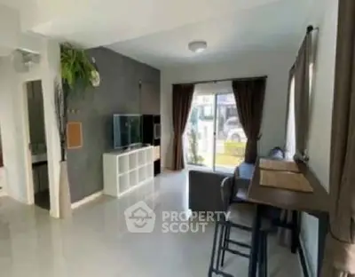 Spacious living room with modern decor and natural light