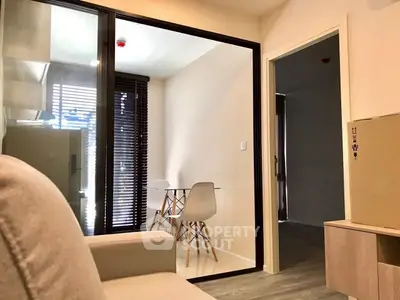 Modern apartment interior with cozy living area and dining space