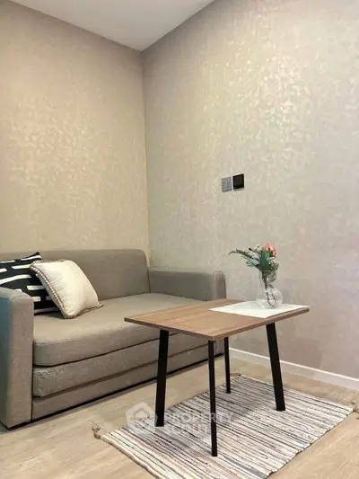 Cozy living room with modern sofa and stylish coffee table, perfect for relaxation.