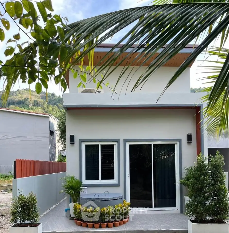 Charming modern two-story house with lush greenery and stylish exterior design.