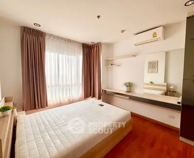 Modern bedroom with large window and wooden flooring, featuring a minimalist design.