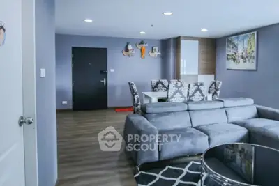 Modern living room with stylish decor and comfortable seating in a contemporary apartment.