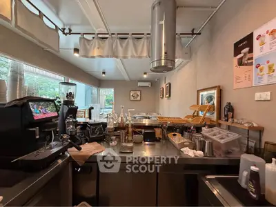 Chic modern kitchen with stainless steel appliances and cozy decor, perfect for culinary enthusiasts.