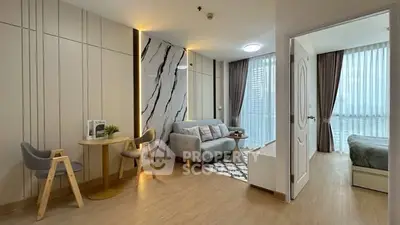 Modern living room with stylish decor and natural light in a contemporary apartment.
