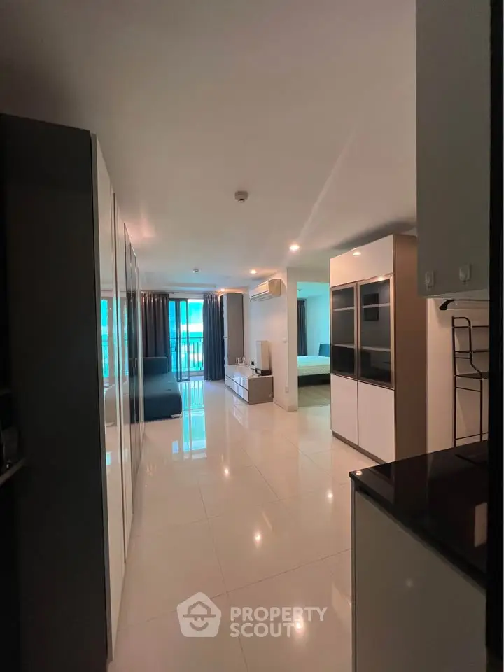 Spacious modern apartment with open layout and sleek design, featuring a bright living area and stylish furnishings.
