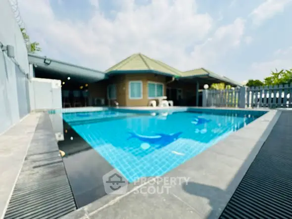 Stunning private pool with modern design in a serene residential setting.