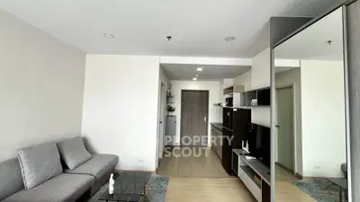 Modern living room with sleek kitchen in open layout apartment