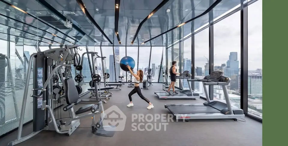 Luxurious high-rise gym with stunning city views and modern fitness equipment.