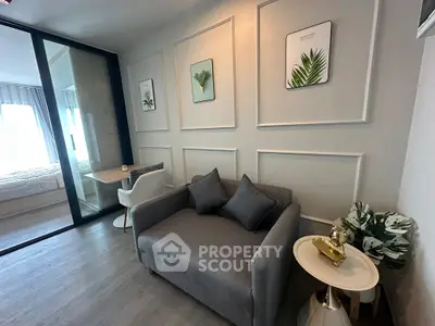 Modern living room with stylish decor and cozy seating in a contemporary apartment.