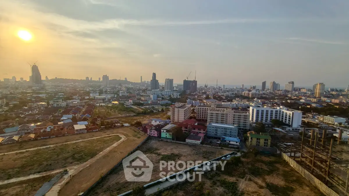 Stunning cityscape view from high-rise building at sunset, showcasing urban skyline and vibrant city life.