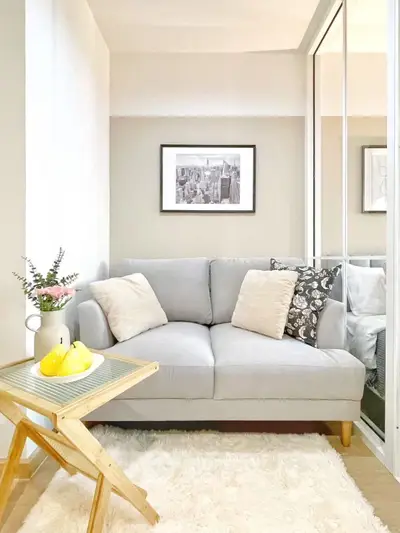 Cozy living room with stylish sofa and decor in modern apartment