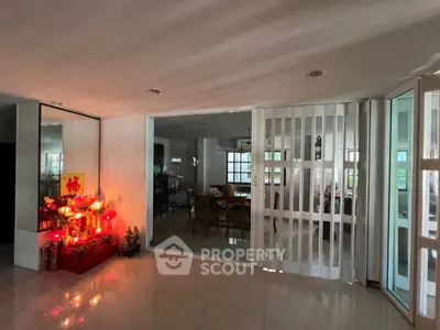Spacious living area with modern sliding doors and decorative elements