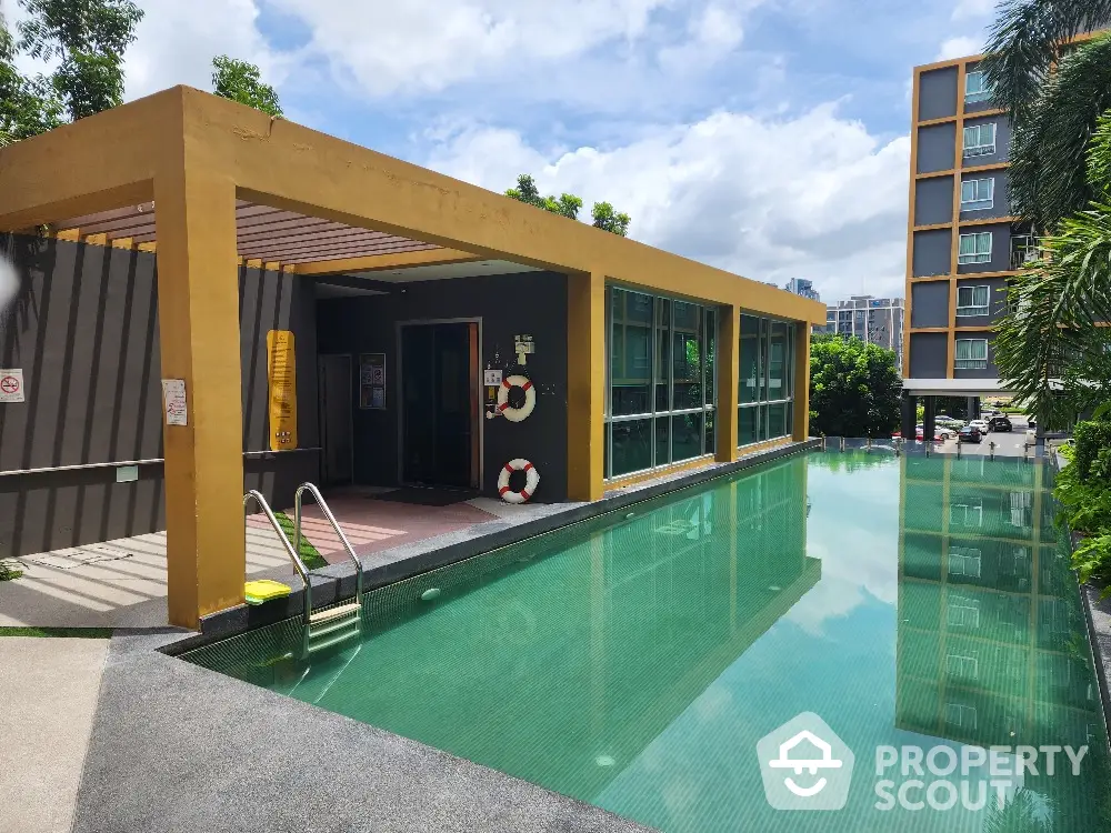 Luxurious poolside living with modern amenities, surrounded by lush greenery and a high-rise urban backdrop, perfect for upscale relaxation and entertainment.