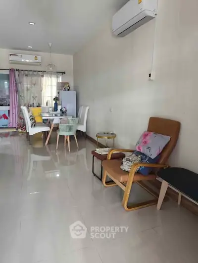 Modern living room with stylish furniture and air conditioning, perfect for comfortable living.