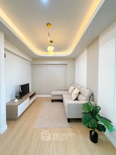 Modern living room with stylish lighting and cozy furniture