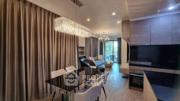 Luxurious open-plan living room with elegant dining area and modern kitchen