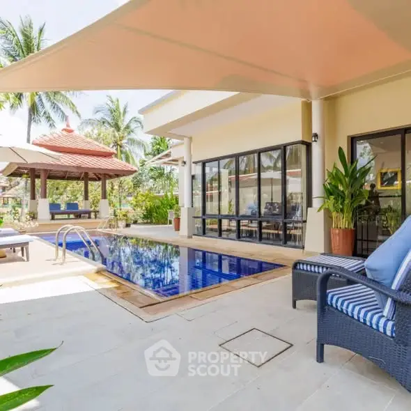 Luxurious villa with private pool and tropical garden, perfect for relaxation and entertaining.