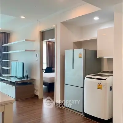 Modern apartment interior with sleek kitchen and cozy living area