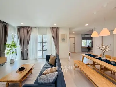 Spacious modern living room with elegant dining area and natural light
