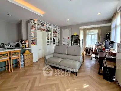 Spacious living room with modern decor and ample natural light