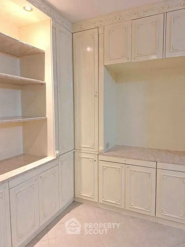 Elegant built-in storage cabinets with classic design and ample shelving space.
